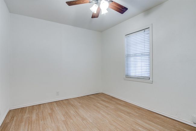 Spare room with wood finished floors and ceiling fan | Image 14