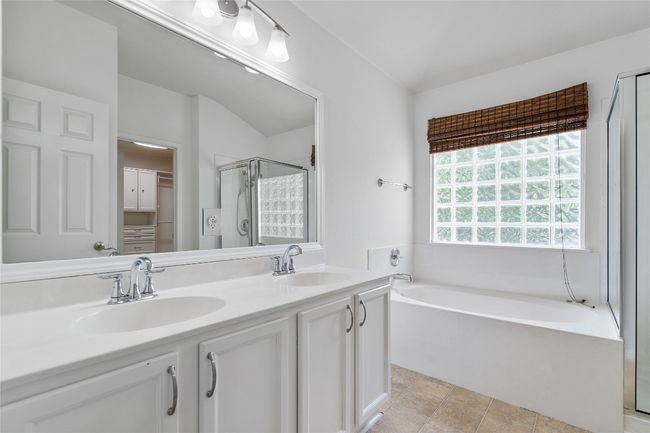 Primary Bath Features Dual Vanities and Garden Tub | Image 18
