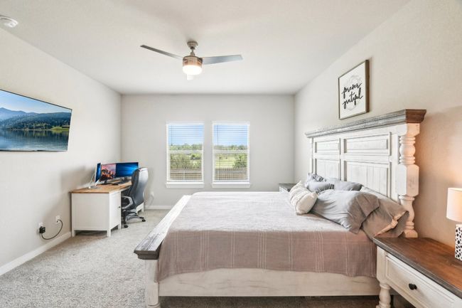 Primary bedroom with a window overlooking the greenbelt | Image 17