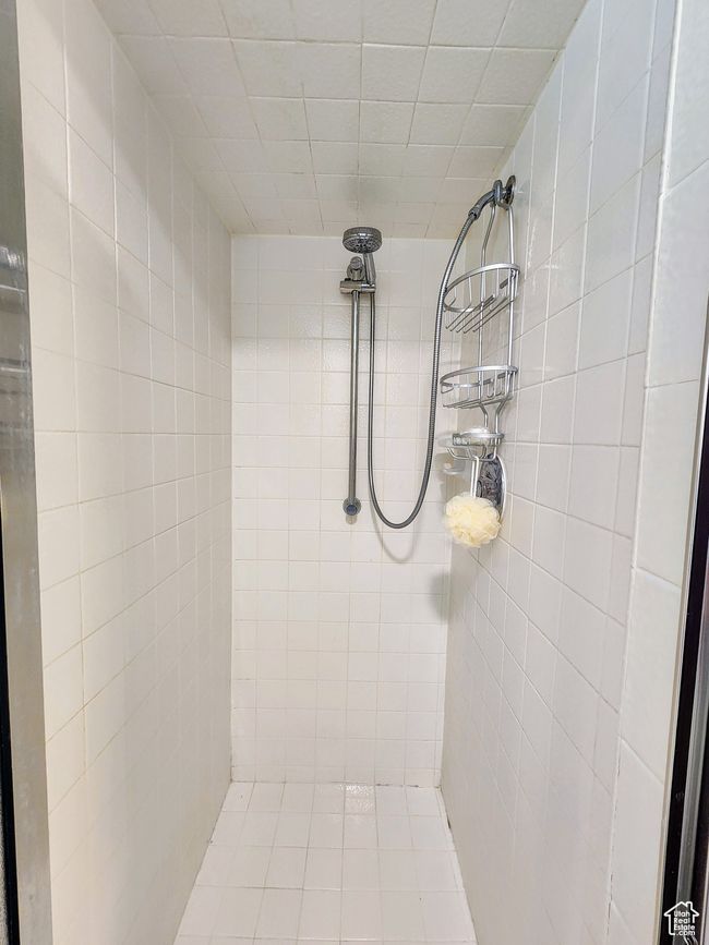 Full bath featuring a tile shower | Image 38