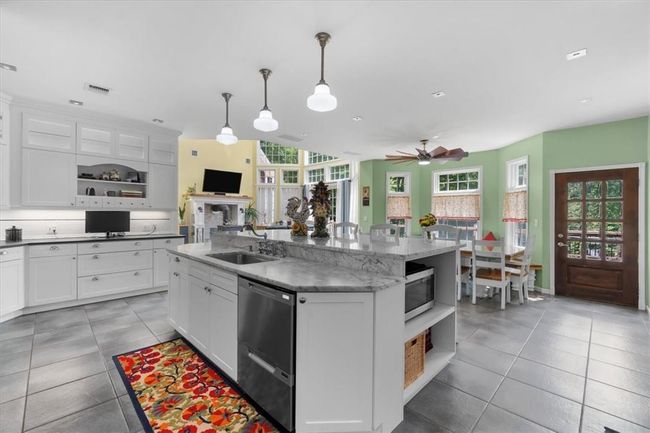 Fisher & Paykel SS applicances. 9' multitiered marble island. | Image 14