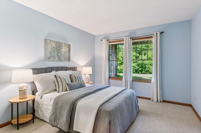 Two generous lower-level bedrooms with brand-new plush carpeting. | Image 22