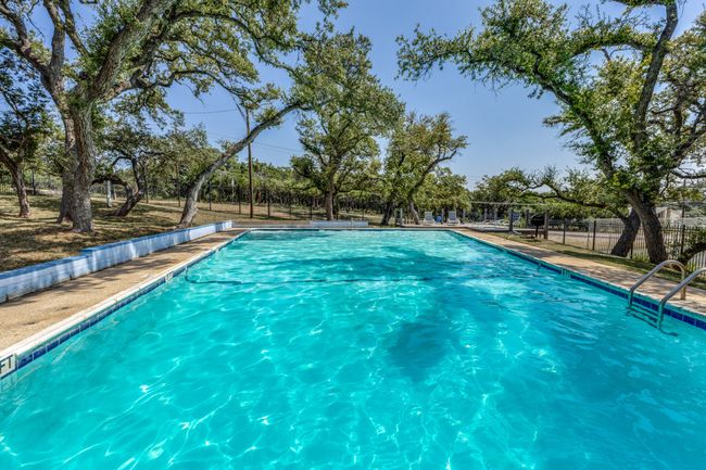 Community pool featuring fence | Image 39