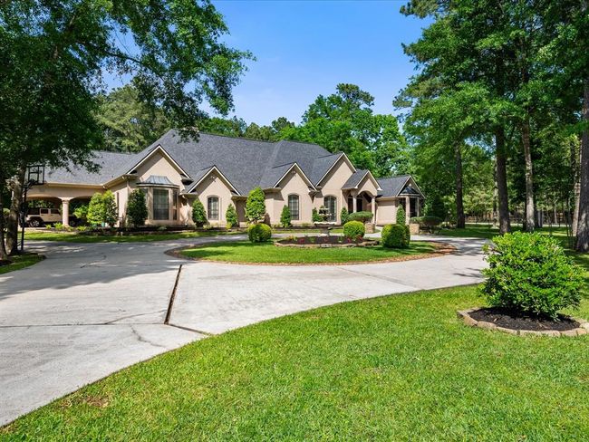 The sweeping driveway and front lawn make for a stunning approach—ideal for gatherings or everyday luxury. | Image 4