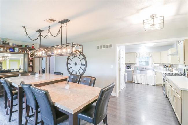 Dining room featuring dark wood-type flooring | Image 19