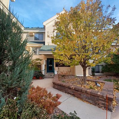 Lush manicured grounds & walking paths with private courtyard right outside your front door | Image 1