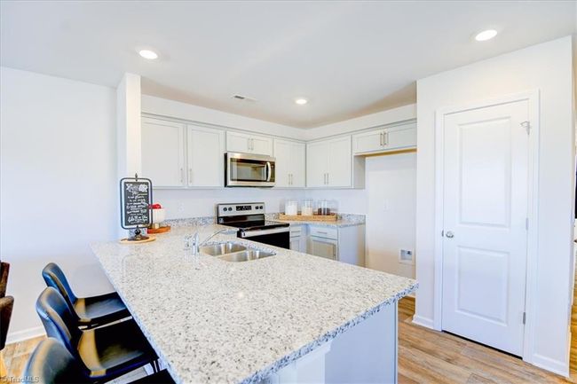 ALL PHOTOS ARE REPRESENTATIVE, NOT OF THE ACTUAL HOME. CABINETS ARE CANE SUGAR IN THE ACTUAL HOME. | Image 11