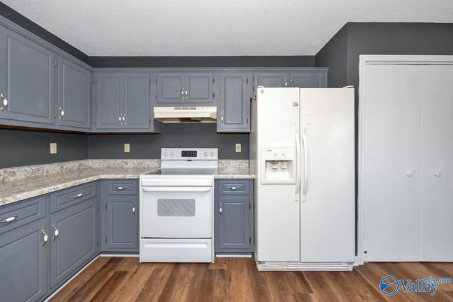 New LVP flooring and paint, wood cabinetry, pantry | Image 25