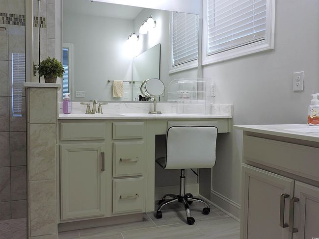 Full bathroom featuring vanity and tiled shower | Image 24