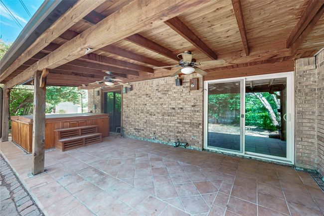 View of patio featuring a ceiling fan and a hot tub | Image 17