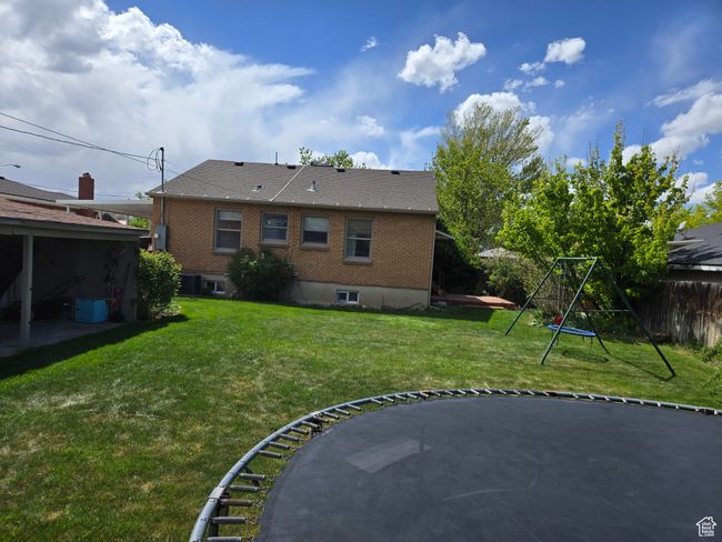View of yard with fence and central AC | Image 45