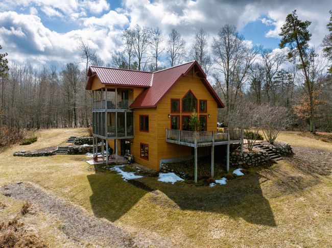 There are multiple outdoor living spaces to enjoy the peace and privacy of this unique retreat. | Image 5
