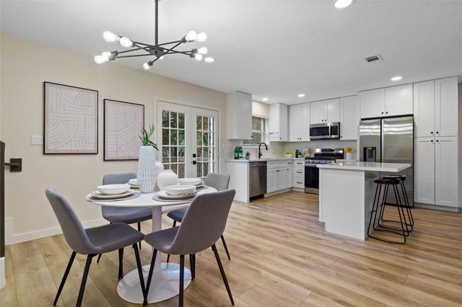 Dining room with visible vents, an inviting chandelier, and recessed lighting | Image 19