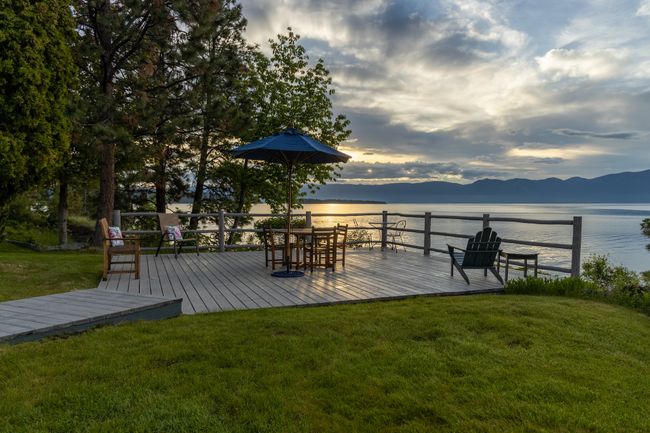 Deck at dusk featuring a water and mountain view and a lawn | Image 48