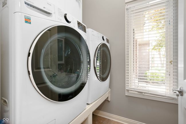 laundry room with washer and clothes dryer, convey with the home | Image 25