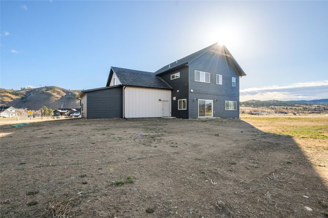 Back of property with a mountain view | Image 46
