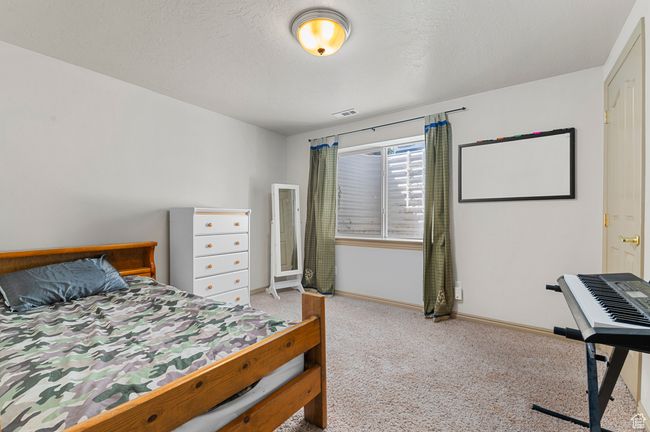 Bedroom featuring carpet floors and baseboards | Image 21