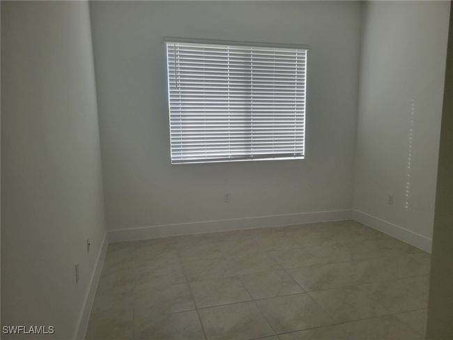 Unfurnished room featuring baseboards and light tile patterned floors | Image 20