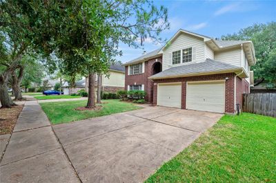 With its inviting curb appeal and serene surroundings, this property offers the perfect retreat for those seeking peace and comfort in a beautiful neighborhood. | Image 2