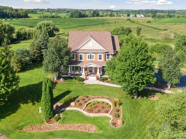 Entire yard is professionally landscaped with mature trees. | Image 83