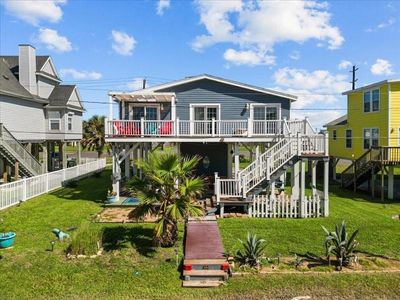 Discover Your Coastal Retreat: A charming elevated residence boasting a spacious deck, picturesque views, and a serene outdoor oasis for the ultimate relaxation and entertainment. | Image 3