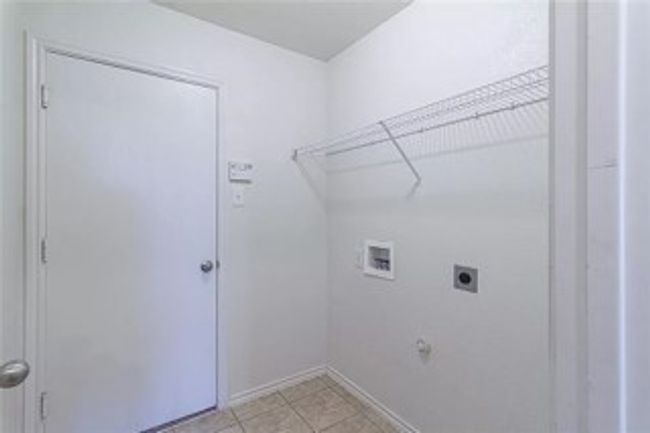 Washroom with hookup for a washing machine and hookup for an electric dryer | Image 9