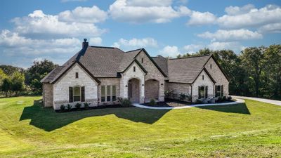 French provincial home with a front lawn | Image 1