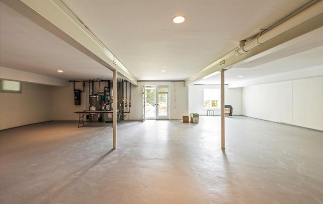 Below grade area featuring recessed lighting, water heater, and a central vacuum unit | Image 32