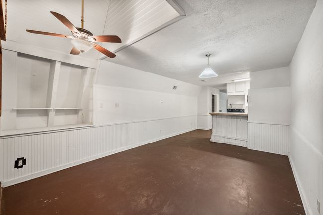 Unfurnished living room with finished concrete floors | Image 16
