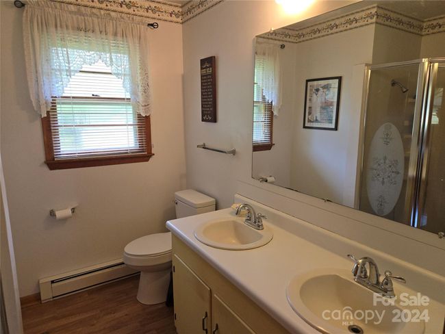 2 bedrooms share this hall bath with walk-in shower | Image 13