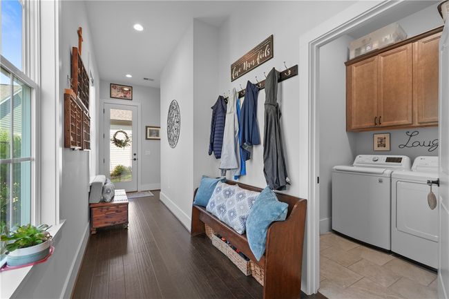 Nice wide back hall leading to the primary suite. Plenty of room to function as a landing zone. | Image 16