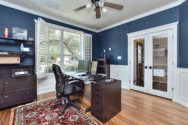 Nice wood floors, custom paint, plantation shutters and french doors off the entry make this a perfect place to get work done! | Image 6
