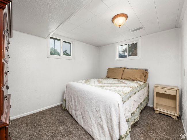 Carpeted bedroom with multiple windows | Image 15