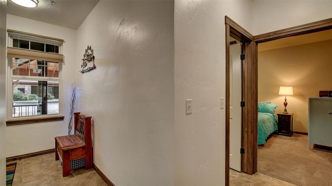 Entry way and corridor to guest bedroom | Image 15
