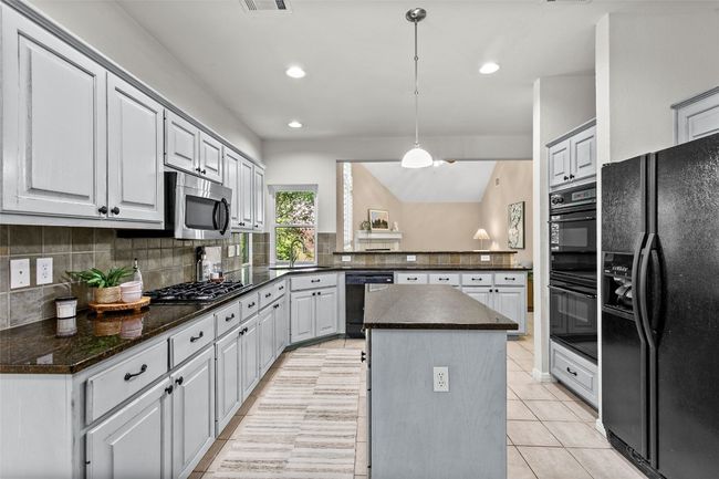 The kitchen also offers a large and spacious pantry | Image 16