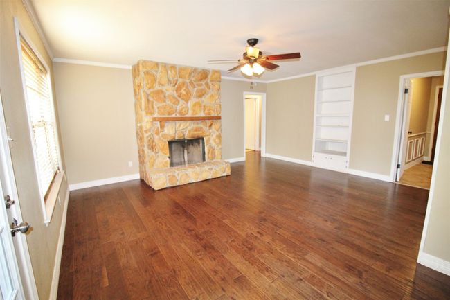 Wood flooring. Entry to the open patio | Image 8