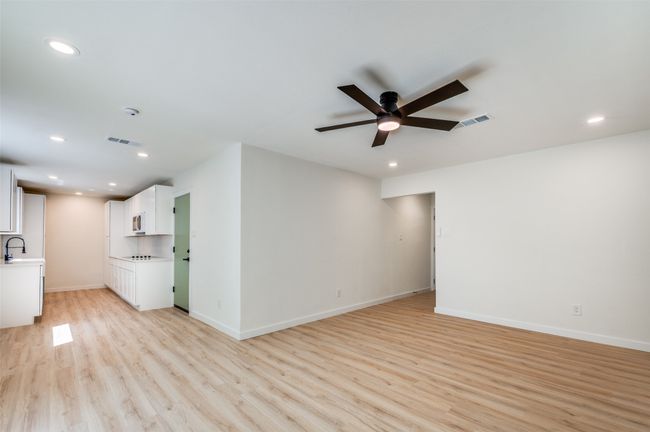Spare room featuring recessed lighting, a ceiling fan, and light wood-style flooring | Image 5