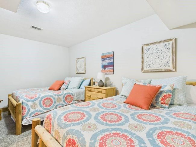 Bedroom 2 with visible vents and carpet flooring | Image 55
