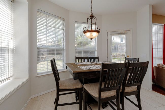 Dining room with baseboards | Image 17