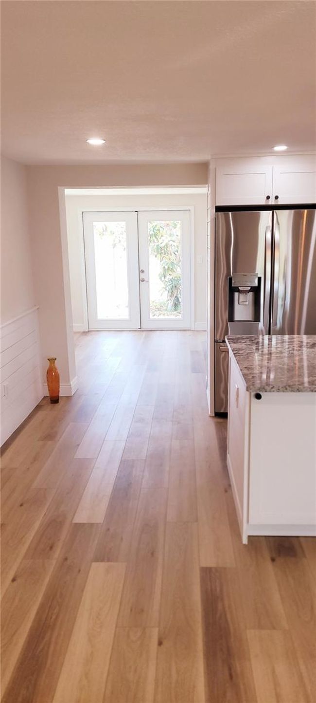 walkway to dining room with doors opening to the back yard | Image 5