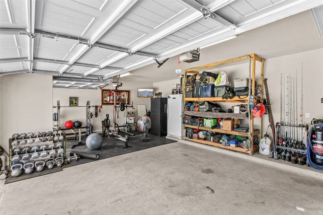 Garage featuring a garage door opener | Image 29