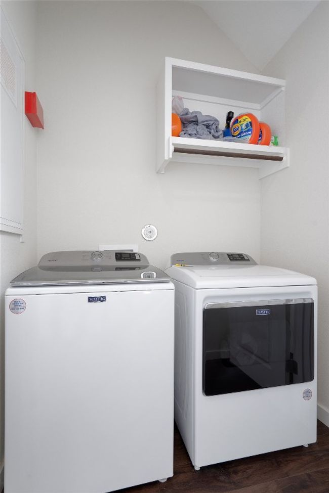 Laundry area featuring independent washer and dryer and dark wood-type flooring | Image 35