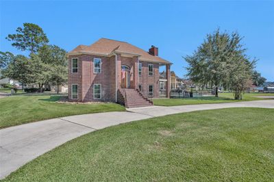 Impressive entry with room for a crowd. Low maintenance, all brick with fully sprinklered lawn. | Image 3