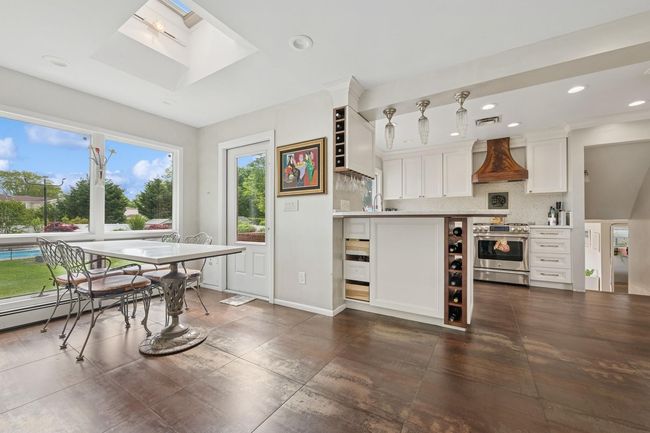 Dining space with a skylight and recessed lighting | Image 11