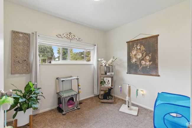 Interior space featuring carpet flooring and baseboards | Image 37