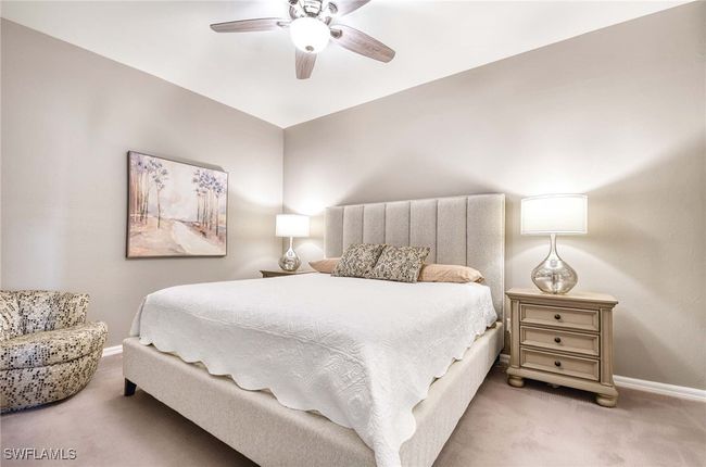Primary Bedroom en suite with ceiling fan. | Image 11