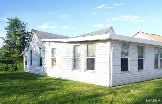 View of home's exterior featuring a yard | Image 4