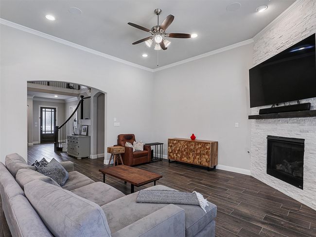 Family room open to kitchen with a view of the backyard | Image 8