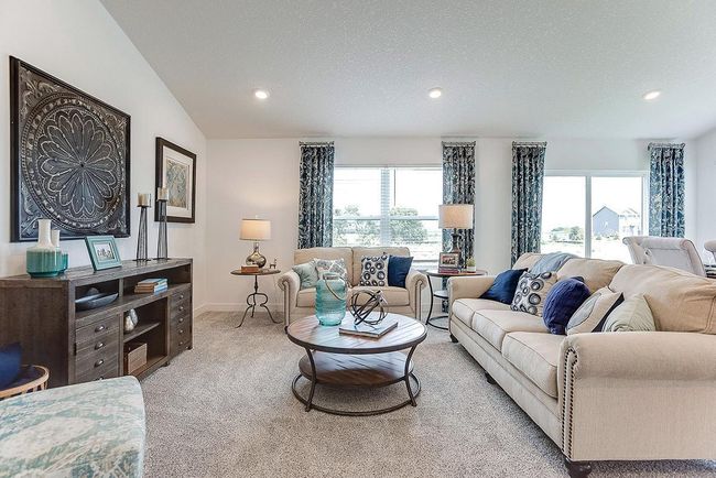 Family room with cozy gas fireplace (not shown). Photo of Model home. Options and colors may vary. Ask Sales Agent for details. | Image 12
