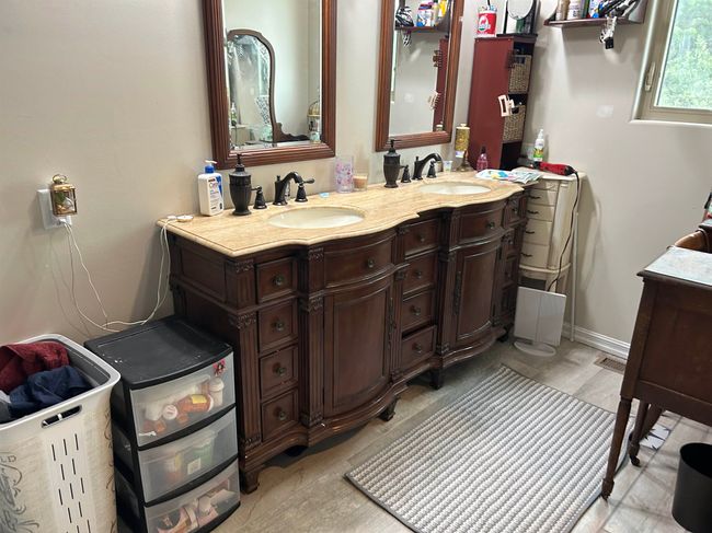 Bathroom featuring double vanity and a sink | Image 21